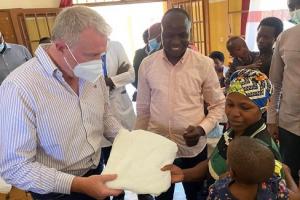 James Sunderiand MP handing out mosquito nets to combat malaria